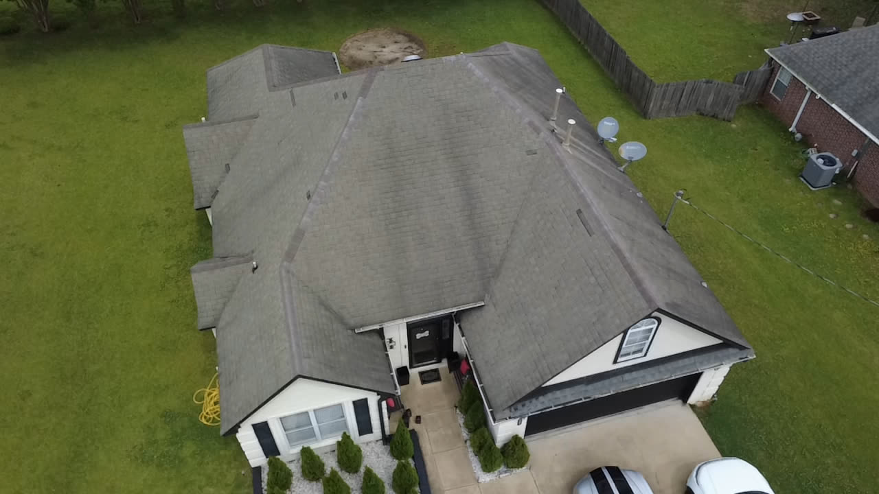 An Oxford house before the new roof: faded grey shingles seen from the drone